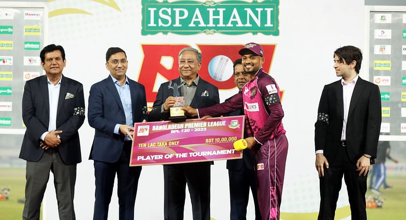 Najmul Hossain Shanto receives the player of the tournament award from the Bangladesh Cricket Board (BCB) president Nazmul Hassan after the final of the Bangladesh Premier League (BPL) 2023 at the Sher-e-Bangla National Cricket Stadium in Dhaka on 16 February, 2023