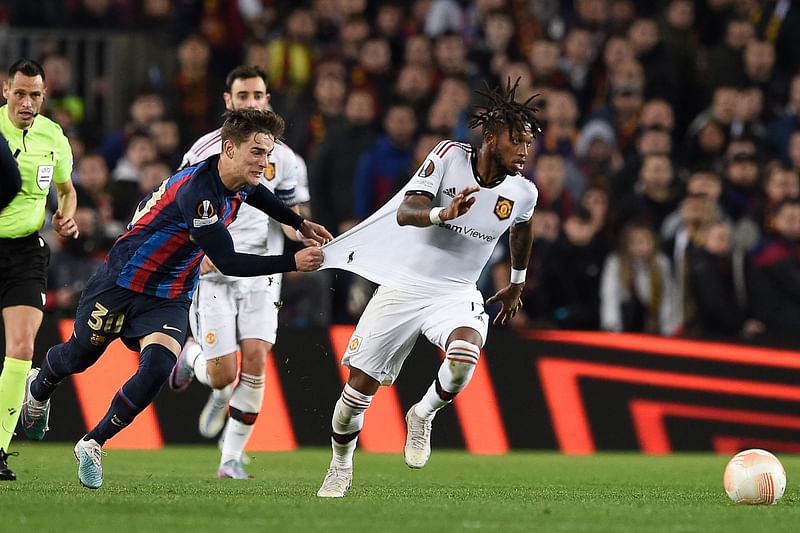 Barcelona's Spanish midfielder Gavi fights for the ball with Manchester United's Brazilian midfielder Fred during the UEFA Europa League round of 32 first-leg match between FC Barcelona and Manchester United at the Camp Nou stadium in Barcelona, on 16 February, 2023