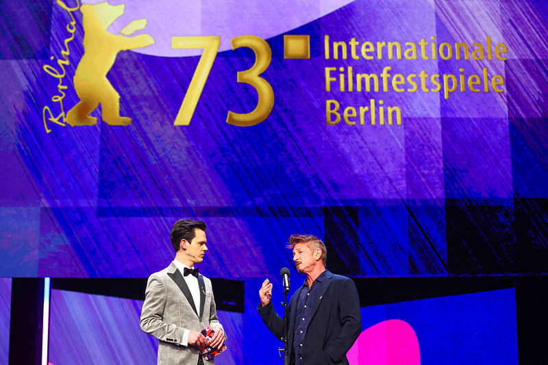 Sean Penn and Jo Schueck speak on stage during the opening gala of the 73rd Berlinale International Film Festival in Berlin, Germany, 17 February, 2023.