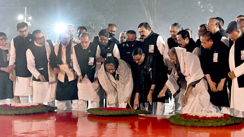 Flanked by cabinet members and senior leaders of the party, Sheikh Hasina, president of Awami League, placing wreath at the Shaheed Minar on 21 February 2023