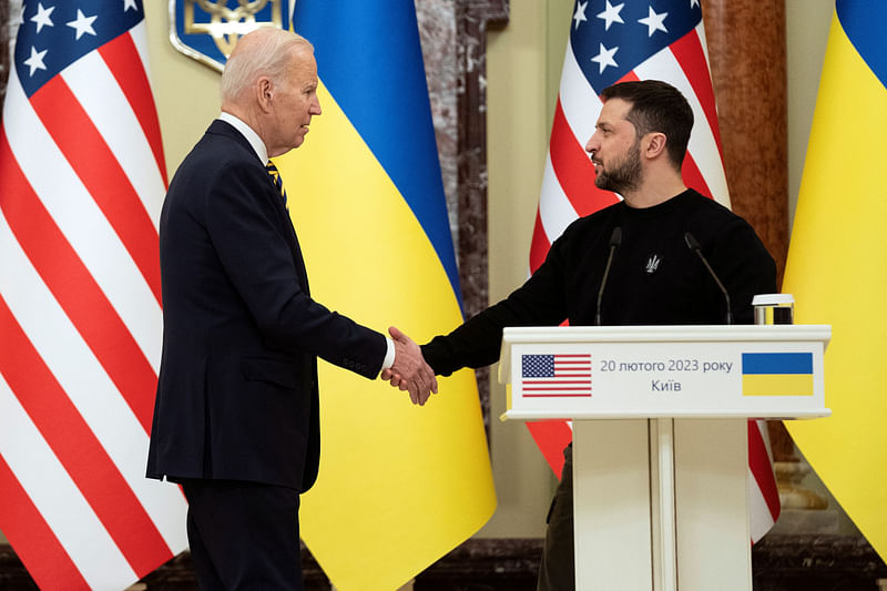 US President Joe Biden shakes hands with Ukrainian President Volodymyr Zelenskiy after they both delivered statements at Mariinsky Palace on an unannounced visit in Kyiv, Ukraine, Monday,