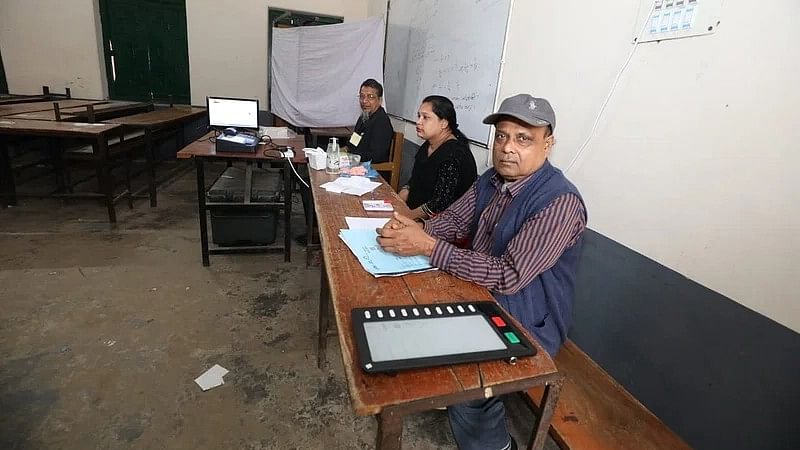 Election officials wait for voters at Annada Government High School centre in Sarail, Brahmanbaria on 1 February 2023