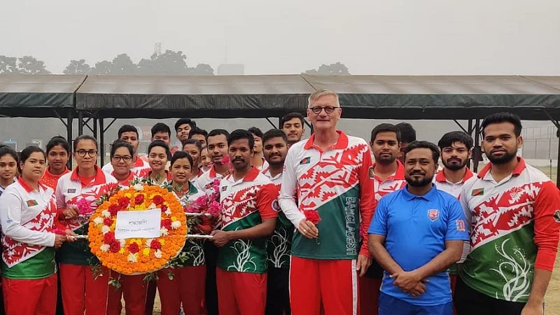 Coach Martin Frederick and the national archery team members pay homage to the language martyrs at the Shaheed Ahsan Ullah Master Stadium in Tongi on 21 February, 2023