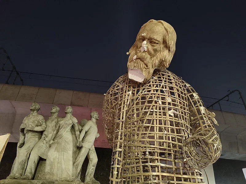 The statue of Rabindranath Tagore stands beside Raju Sculpture on Dhaka University campus after it went missing and had been restored.