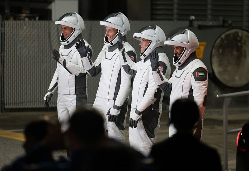 Roscosmos cosmonaut Andrey Fedyaev, NASA astronaut Warren Hoburg, NASA astronaut Stephen Bowen, and UAE (United Arab Emirates) astronaut Sultan Alneyadi walk out of the Operations and Checkout Building on their way to the SpaceX Falcon 9 rocket with the Crew Dragon spacecraft for a scheduled launch from pad 39A at the Kennedy Space Center on 26 February, 2023