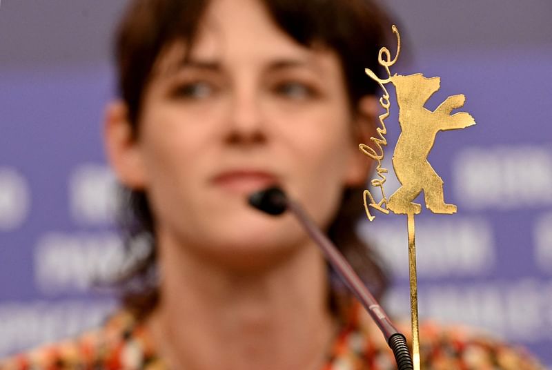 The Berlinale bear logo is seen in the foreground as US actress and Berlinale Jury President Kristen Stewart attends a press conference on the opening day of the Berlinale, Europe's first major film festival of the year, on 16 February, 2023 in Berlin.