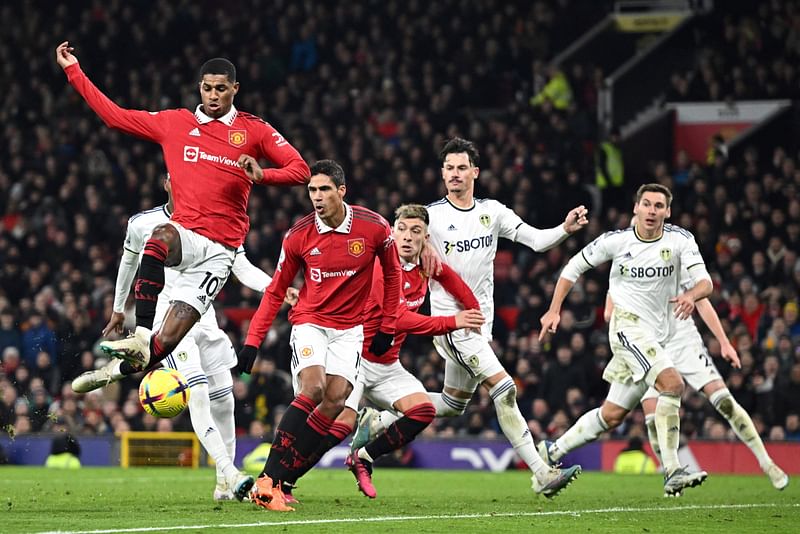 Manchester United's English striker Marcus Rashford (L) shoots and misses to score during the English Premier League football match between Manchester United and Leeds United at Old Trafford in Manchester, north west England, on 8 February, 2023