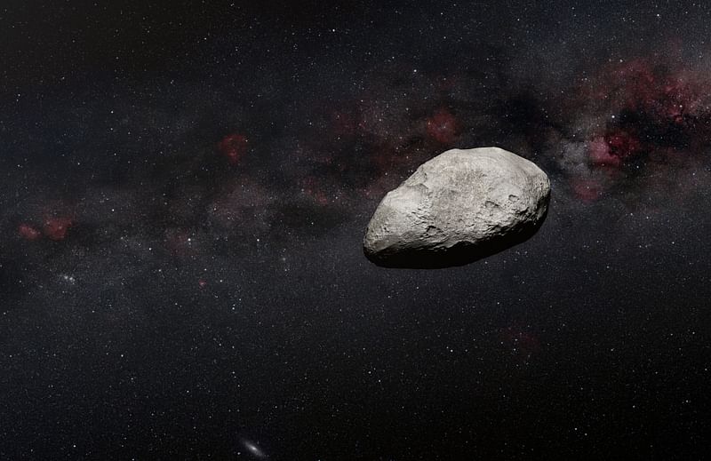 A handout artist’s impression released on 24 March, 2023 by the European Space Agency (ESA) shows a grey, irregularly-shaped asteroid, rocky objects that often pass safely past Earth. A large asteroid will safely zoom between Earth and the Moon on 25 March, 2023, a once-in-a-decade event that will be used as a training exercise for future planetary defence efforts, the European Space Agency said.