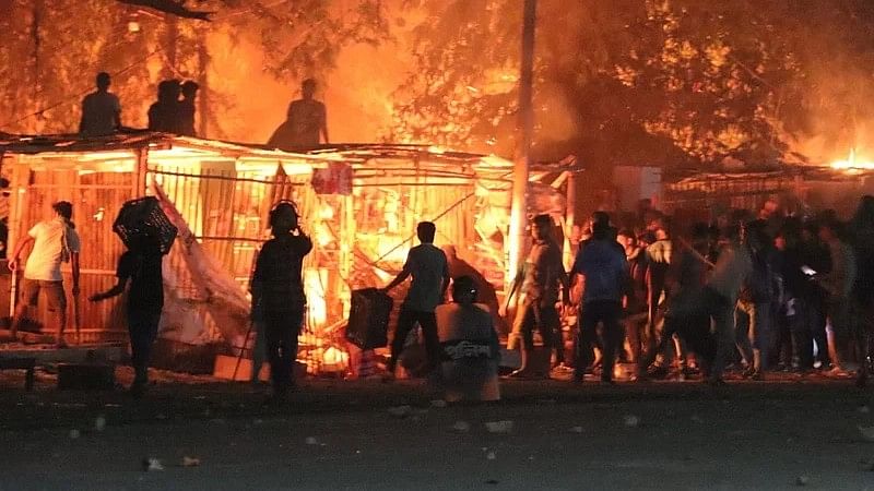 Shops were set on fire during a clash between students of Rajshahi University and the locals at Binodpur gate area on 11 March 2023