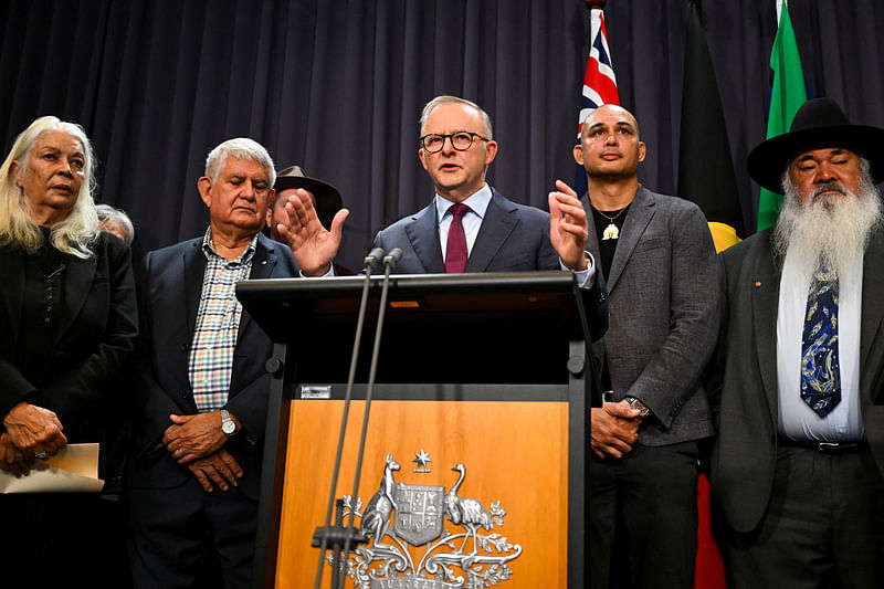 Australian Prime Minister Anthony Albanese, surrounded by members of the First Nations Referendum Working Group, speaks to the media during a news conference at Parliament House in Canberra, March 23, 2023