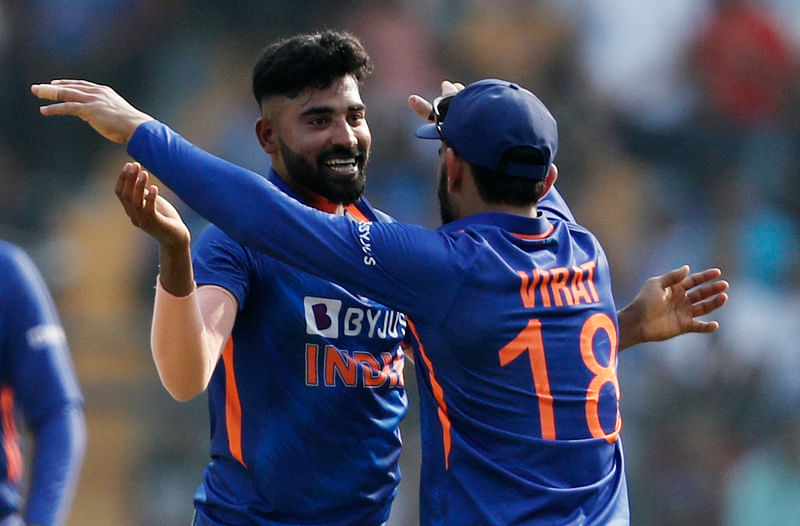 India's Mohammed Siraj celebrates after taking the wicket of Australia's Adam Zampa with Virat Kohli in the 1st ODI between India and Australia at the Wankhede Stadium in Mumbai, India 17 March 2023