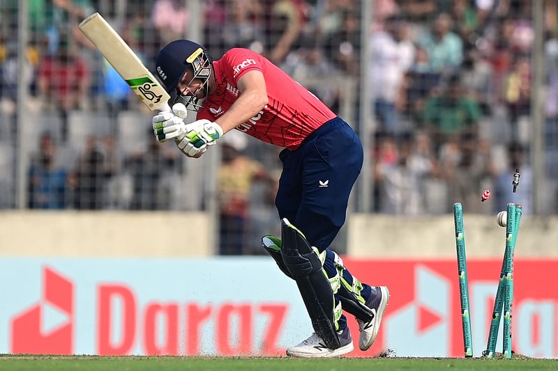 England's captain Jos Buttler is clean bowled during the second Twenty20 international cricket match between Bangladesh and England at the Sher-e-Bangla National Cricket Stadium in Dhaka on 12 March, 2023