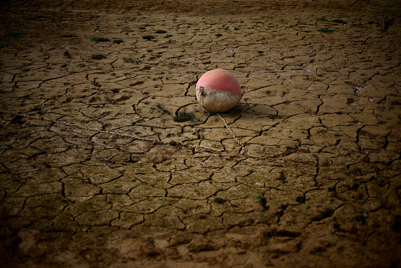 A buoy is seen on the banks of the partially dry Lake Montbel at the foot of the Pyrenees Mountains as France faces records winter dry spell raising fears of another summer of droughts and water restrictions, March 13, 2023