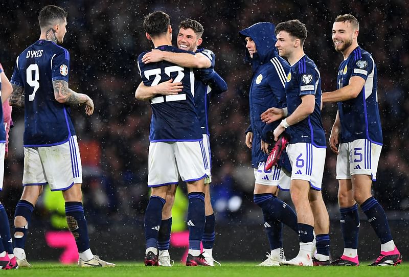 Scotland players celebrate after the UEFA Euro 2024 group A qualification match between Scotland and Spain at Hampden Park stadium in Glasgow on 28 March 2023