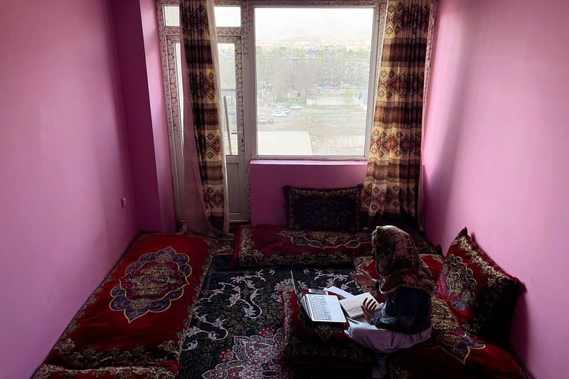 Sofia, an Afghan student, speaks English during an online class, at her house in Kabul, Afghanistan, March 18, 2023