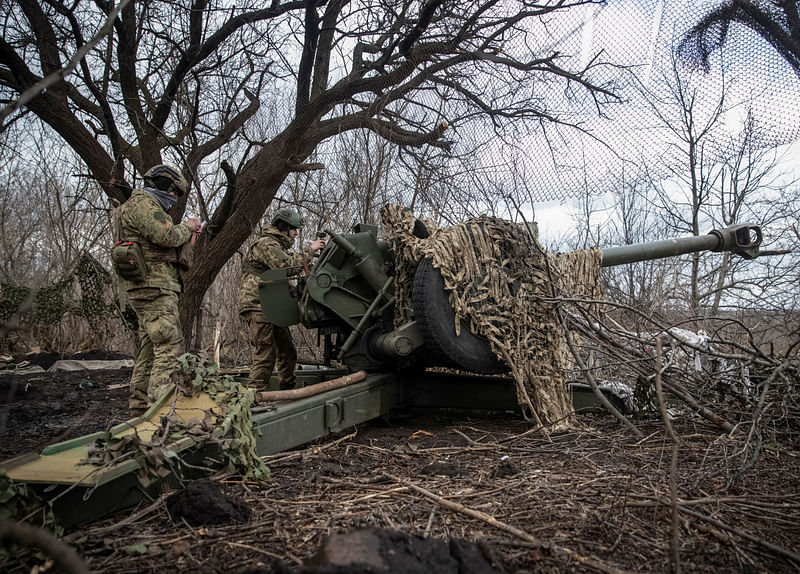 Ukrainian service members prepare to shoot from a howitzer at a front line, as Russia’s attack on Ukraine continues, near the city of Bakhmut, Donetsk region, Ukraine on 2 March, 2023