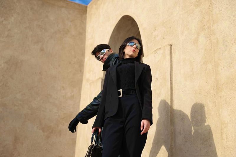 In a palm grove north of Baghdad, bemused Iraqi shepherds looked on as models paraded second-hand garments down an improvised catwalk, seeking to raise awareness of the fashion industry's environmental impact.