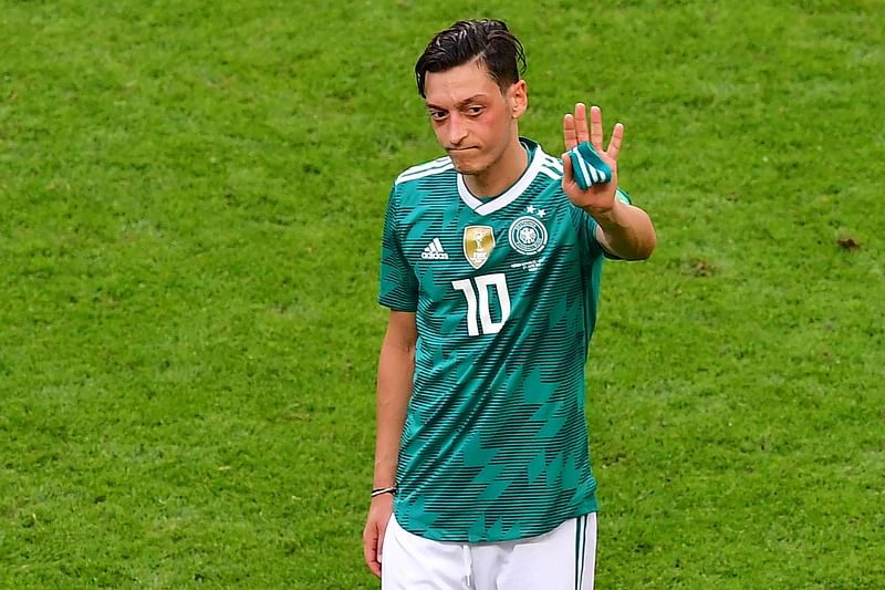 In this file photo taken on 27 June, 2018 Germany's midfielder Mesut Ozil reacts at the end of the Russia 2018 World Cup Group F football match between South Korea and Germany at the Kazan Arena in Kazan