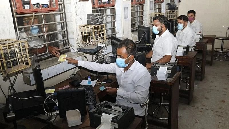 Railway employees selling tickets at the counters