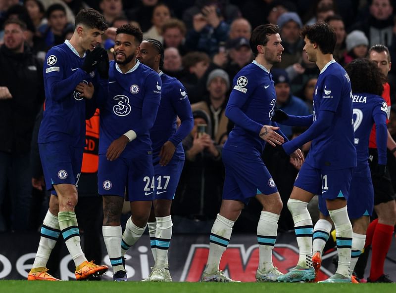 Chelsea's German midfielder Kai Havertz (L) is mobbed by teammates after scoring the team's second goal from the penalty spot during the UEFA Champions League round of 16 second-leg football match between Chelsea and Borrusia Dortmund at Stamford Bridge in London on 7 March, 2023