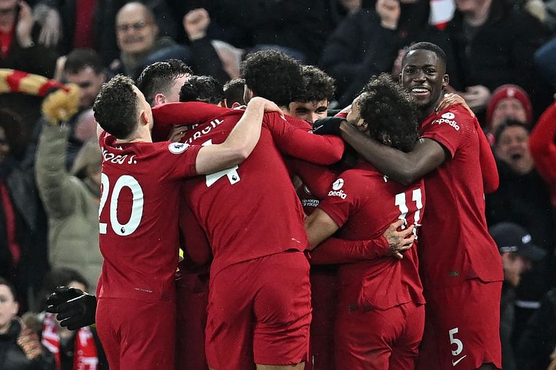 Liverpool's Brazilian striker Roberto Firmino celebrates with teammates after scoring their seventh goal during the English Premier League football match between Liverpool and Manchester United at Anfield in Liverpool, north west England on 5 March, 2023