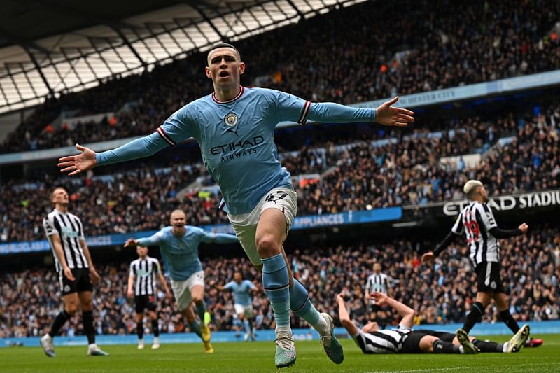 Manchester City's English midfielder Phil Foden celebrates after scoring the opening goal of the English Premier League football match between Manchester City and Newcastle United at the Etihad Stadium in Manchester, north west England, on March 4, 2023