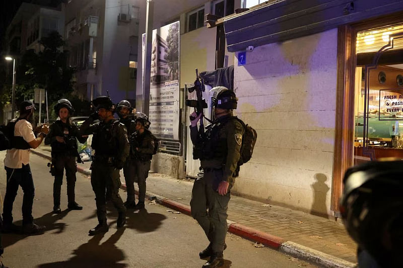 Israeli security personnel work at the scene of a suspected shooting attack in central Tel Aviv, Israel on 9 March, 2023.