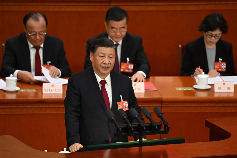 China's President Xi Jinping speaks during the closing session of the National People's Congress (NPC) at the Great Hall of the People in Beijing on 13 March, 2023