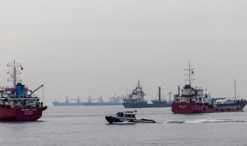 Commercial vessels including vessels that are part of Black Sea grain deal wait to pass the Bosphorus strait off the shores of Yenikapi during a misty morning in Istanbul, Turkey, October 31, 2022