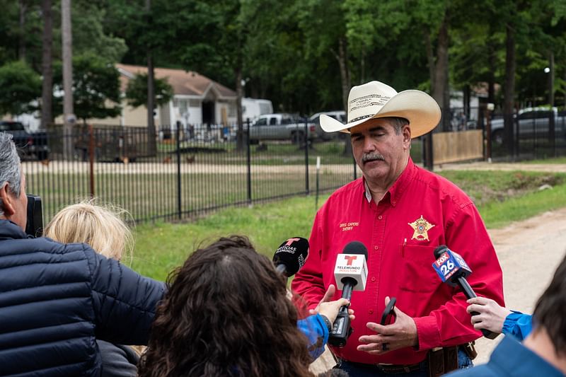 San Jacinto County Sheriff Greg Capers speaks to the media outside of a crime scene where five people, including an 8-year-old child, were killed after a shooting inside a home on April 29, 2023 in Cleveland, Texas