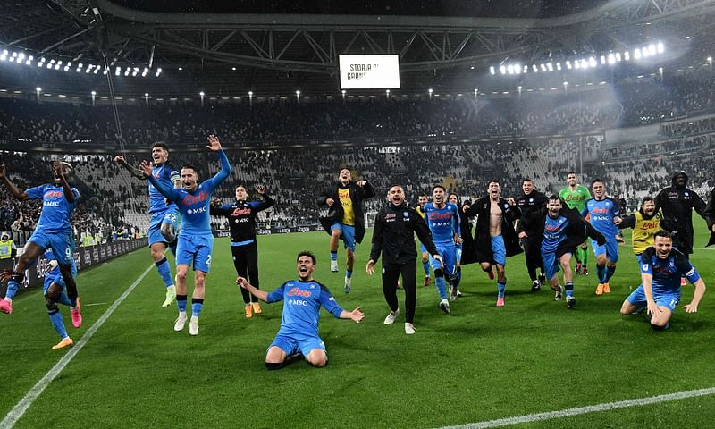 Napoli's players celebrate after winning in the Italian Serie A football match between Juventus and Napoli on 23 April 2023 at the Juventus stadium in Turin