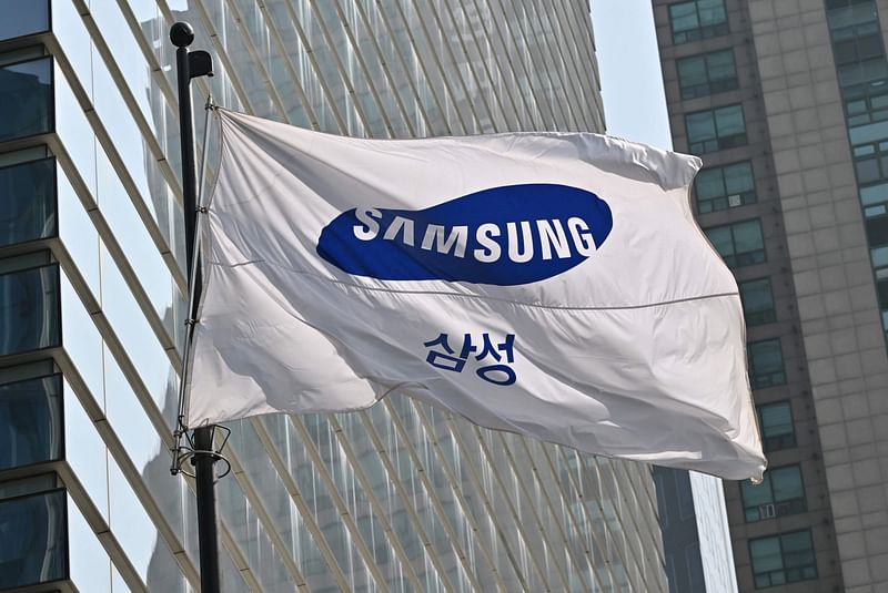 A Samsung flag flutters outside the company's Seocho building in Seoul on April 27, 2023. Samsung Electronics on April 27, reported its worst quarterly profits in 14 years, blaming slowing consumer spending on electronics and a global microchip glut that hit its core memory business.