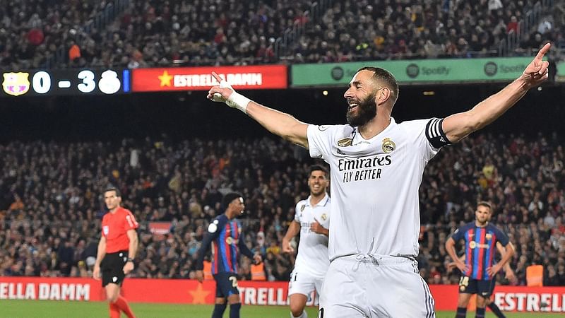 Real Madrid’s French forward Karim Benzema celebrates after scoring his team’s fourth goal during the Copa del Rey (King’s Cup) semi-final second leg football match between FC Barcelona and Real Madrid CF at the Camp Nou stadium in Barcelona on 5 April, 2023