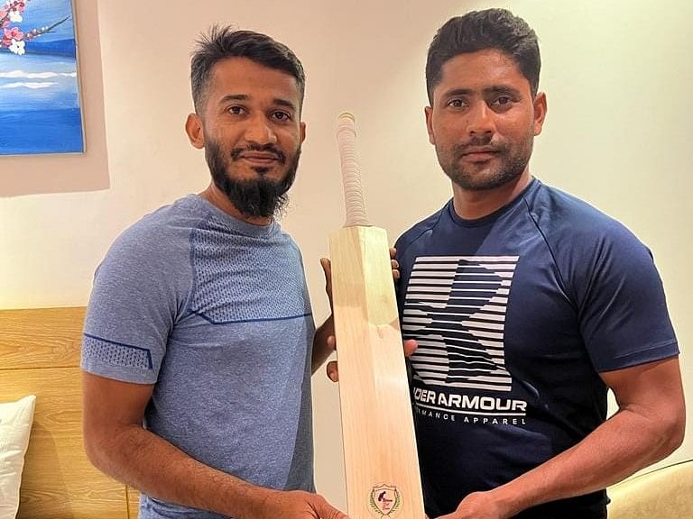 Bangladesh cricketer Imrul Kayes with the 'Bat Doctor' Hussain Mohammad Aftab