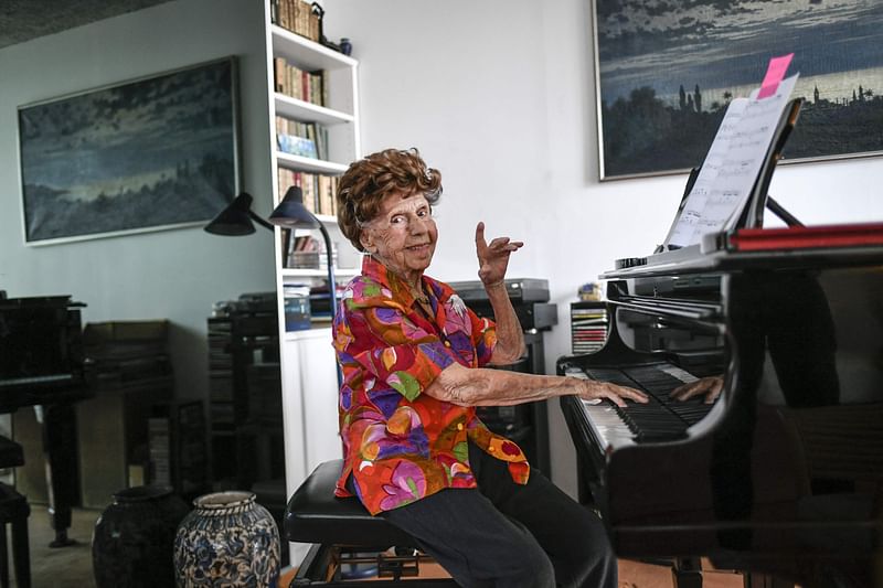 French pianist Colette Maze, 108 years-old, poses during a photo session in Paris on 24 March, 2023