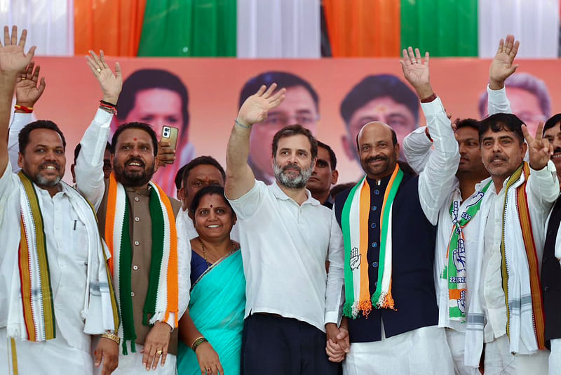 Congress leader Rahul Gandhi with party leaders wave to the supporters during a mega rally at Humnabad, in Bidar on 17 April 2023