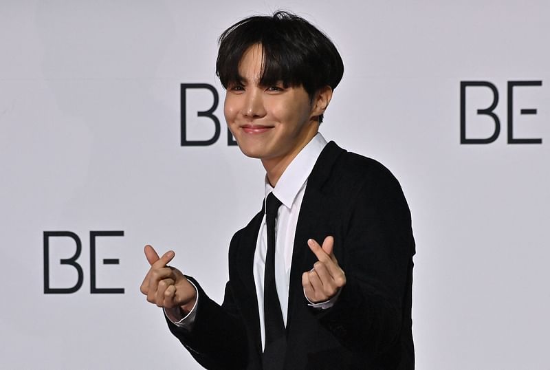 In this file photo taken on 20 November, 2020 South Korean K-pop boy band BTS member J-Hope poses for a photo session during a press conference on BTS new album 'BE (Deluxe Edition)' in Seoul. BTS star J-Hope was set to start his mandatory South Korean military service on 18 April, 2023 local media reported, the second member to report for duty since the K-pop juggernaut went on hiatus last year.