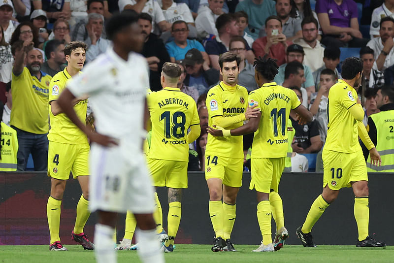 Villarreal players celebrate their second goal scored by Spanish forward Jose Luis Morales during the La Liga match between Real Madrid CF and Villarreal CF at the Santiago Bernabeu Stadium in Madrid on 8 April 2023