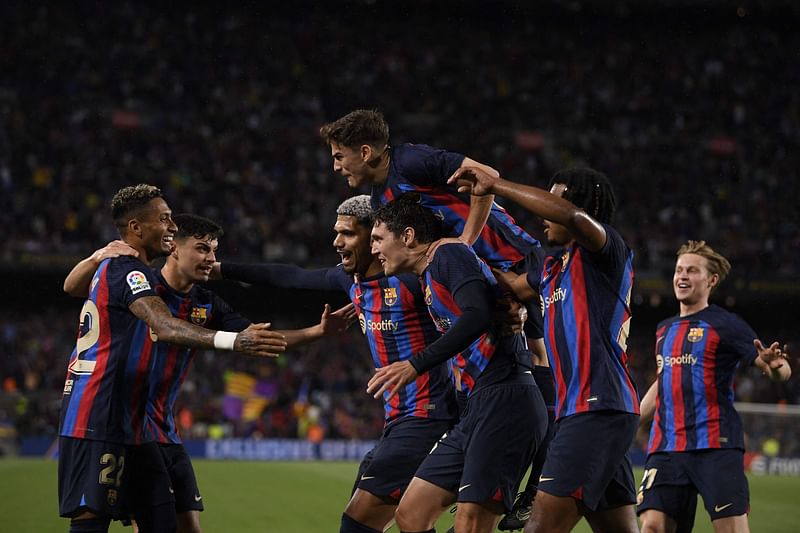 Barcelona's Danish defender Andreas Christensen celebrates with teammates scoring his team's first goal during the La Liga match between FC Barcelona and Real Betis at the Camp Nou stadium in Barcelona on 29 April 2023