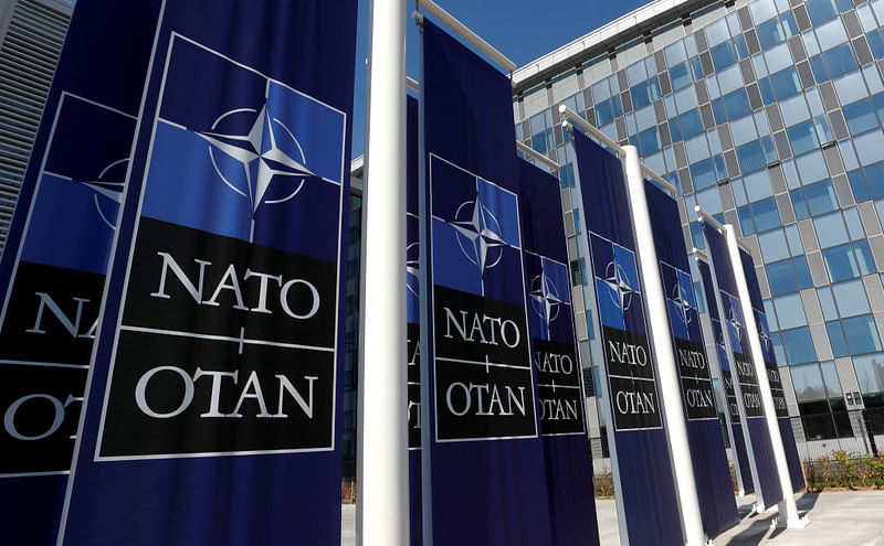 Banners displaying the NATO logo are placed at the entrance of new NATO headquarters during the move to the new building, in Brussels, Belgium on 19 April, 2018