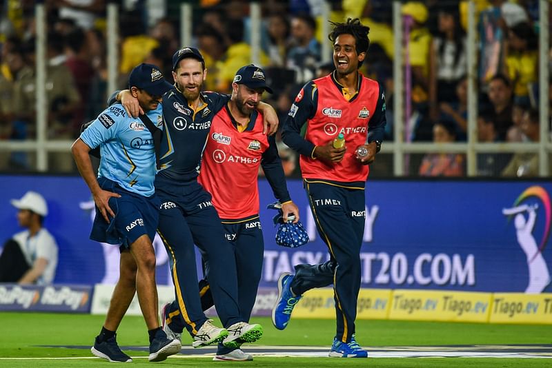 In this file photo taken on 31 March, 2023 Gujarat Titans' Kane Williamson (C) is helped by teammates back to Pavillion after he was injured during the Indian Premier League (IPL) Twenty20 cricket match between Gujarat Titans and Chennai Super Kings at the Narendra Modi Stadium in Ahmedabad