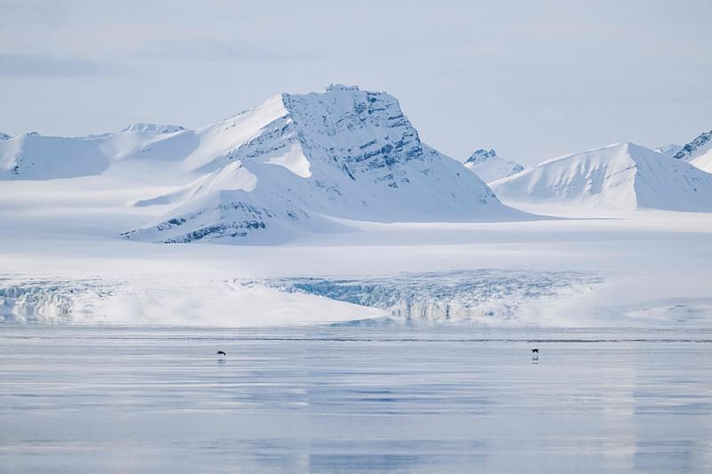 This file photo taken on 3 May, 2022, shows a view of the Nansenbreen glacier in the Borebukta Bay, located at the northwestern side of Isfjorden, in Svalbard Archipelago, northern Norway.