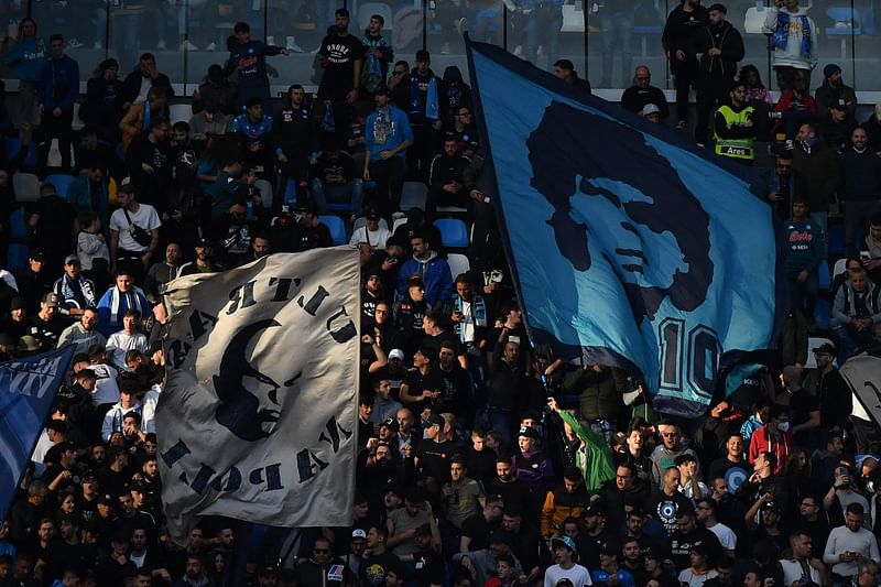 Napoli fans cheer during the Italian Serie A match between Napoli and Udinese on 12 November 2022 at the Diego-Maradona stadium in Naples