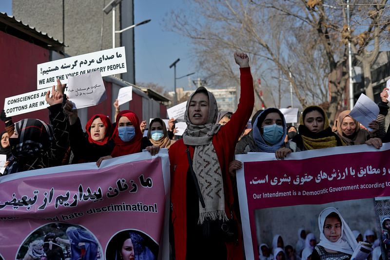 Afghan women shout slogans during a rally to protest against what the protesters say is Taliban restrictions on women, in Kabul, Afghanistan, 28 December, 2021.