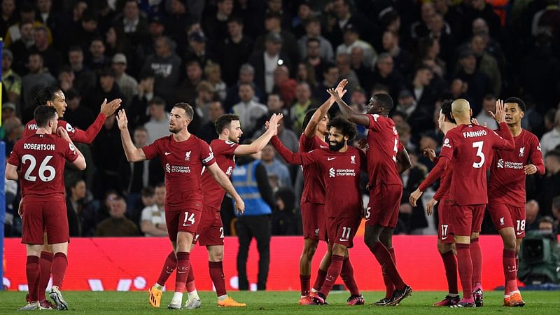 Liverpool's Portuguese striker Diogo Jota (4L) celebrates with teammates after scoring their fifth goal during the English Premier League football match between Leeds United and Liverpool at Elland Road in Leeds, northern England on 17 April, 2023