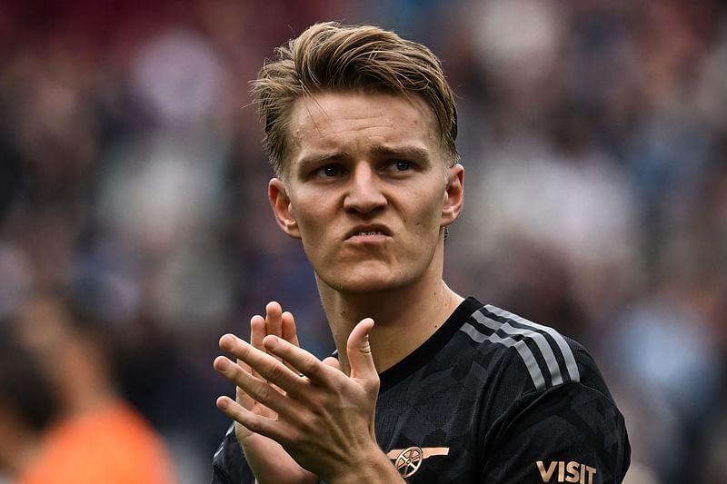 Arsenal's Norwegian midfielder Martin Odegaard reacts at the end of the English Premier League football match between West Ham United and Arsenal at the London Stadium, in London on 16 April, 2023