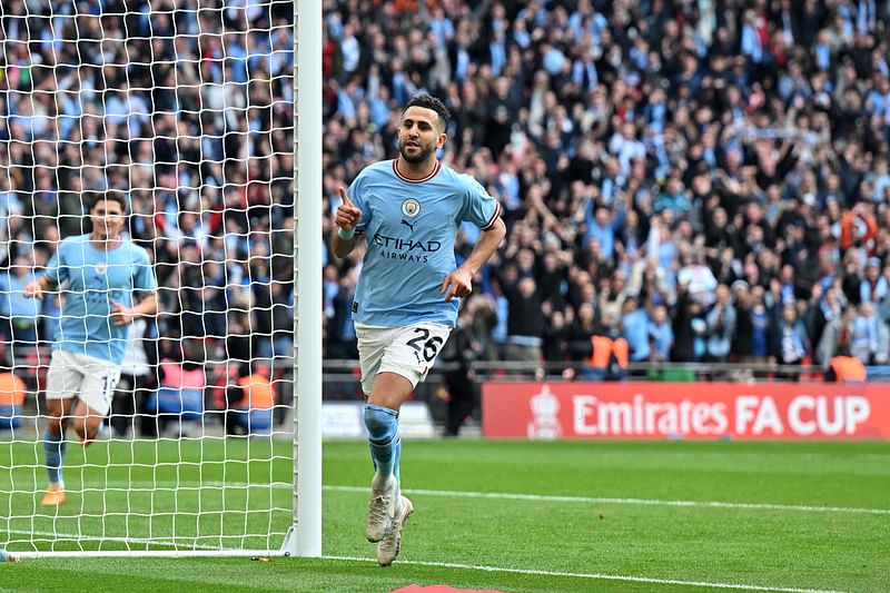 Manchester City's Algerian midfielder Riyad Mahrez celebrates scoring the team's second goal during the English FA Cup semi-final football match against Sheffield United at Wembley Stadium in north west London on 22 April, 2023