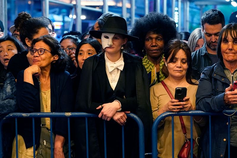 Fans wait outside the Majestic Theatre during the final the final performance of the musical “Phantom of the Opera” at the Majestic Theater in New York City on April 16, 2023