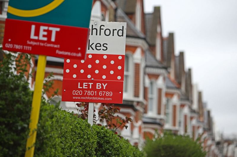 In this file photo taken on April 01, 2023 estate agents rental boards advertising properties to let are pictured outside a row of Victorian terraced houses in Lavender Hill, in south London