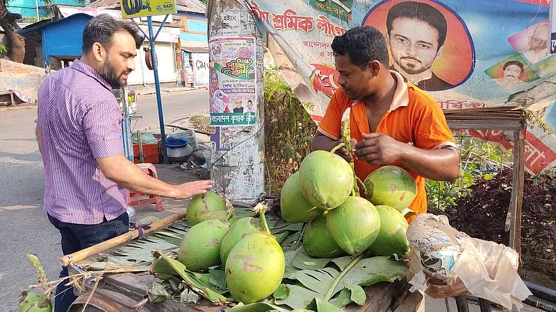 A green coconut vendor in Mithapukurpar, Bagerhat on 19 April 2023